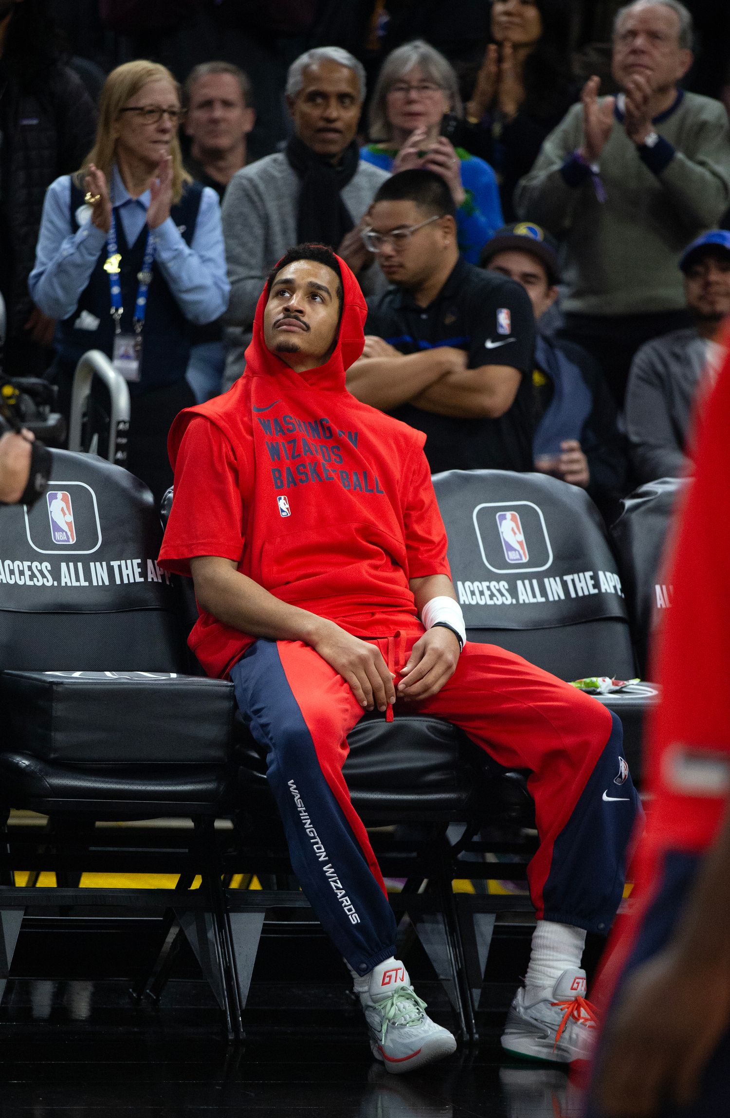 Washington Wizards guard Jordan Poole watches a tribute to him on the big screen by his former team, the Golden State Warriors before the start of their game at Chase Center.